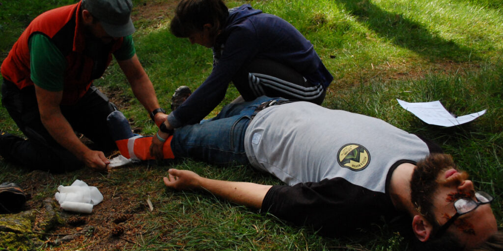 Performing First Aid on Advanced Outdoor Course